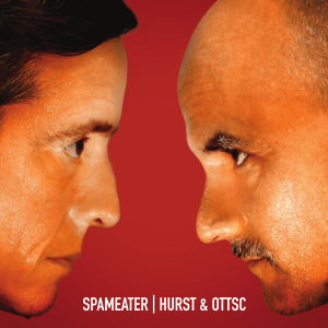 A photograph of Mark Hurst and Scott Williams face-to-face against a red background. On the cover is: SPAMEATER | HURST & OOTSC