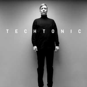 A photograph of Mark Hurst in an office. Thanks to a photography trick, it appears as though he is floating.